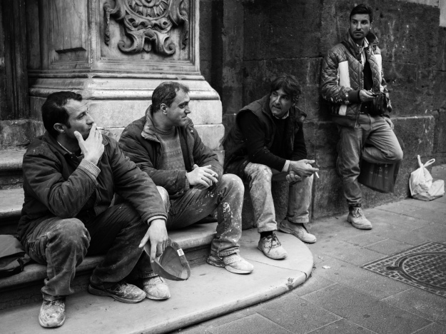 Men Taking a Break from Work to Sit Outside and Smoke